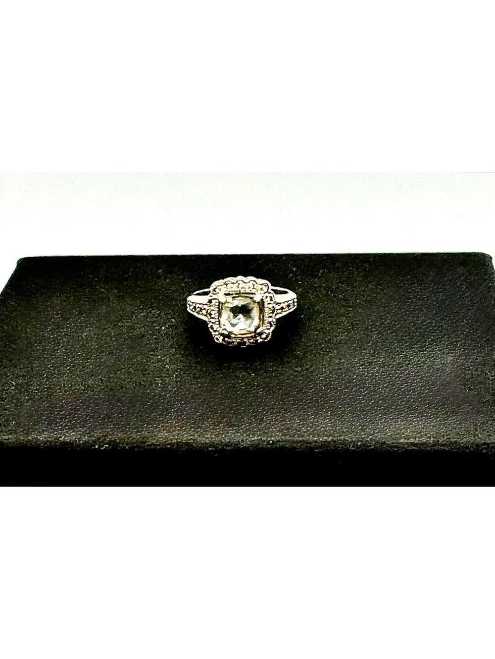 Sterling silver cushion faceted lite green stone w/ clear crystals stones around